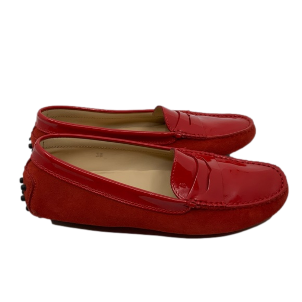 Tod’s red patent leather shoes.